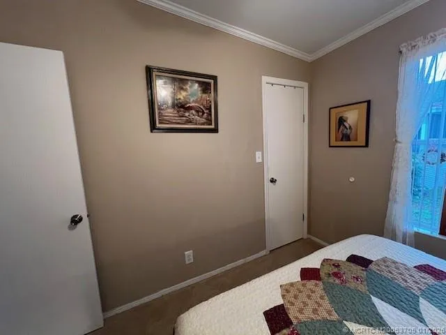 a kitchen with a sink appliances cabinets and a large window