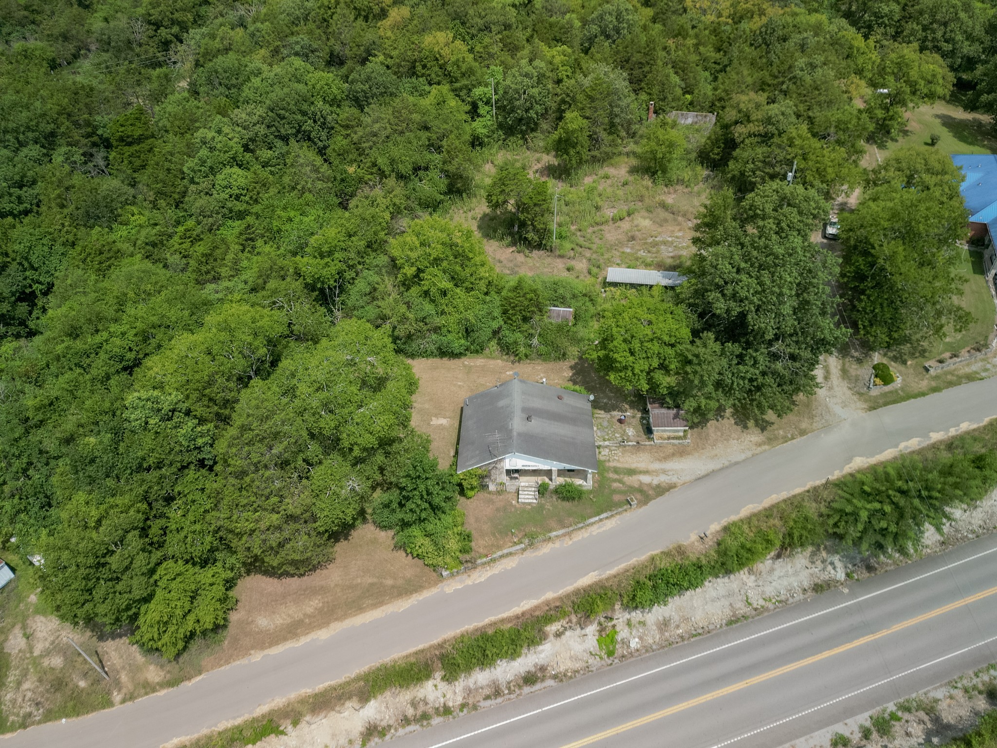 44 Cedar Circle Mulberry, TN 37359 - Photo 19 of 20 an aerial view of a house with a yard and greenery