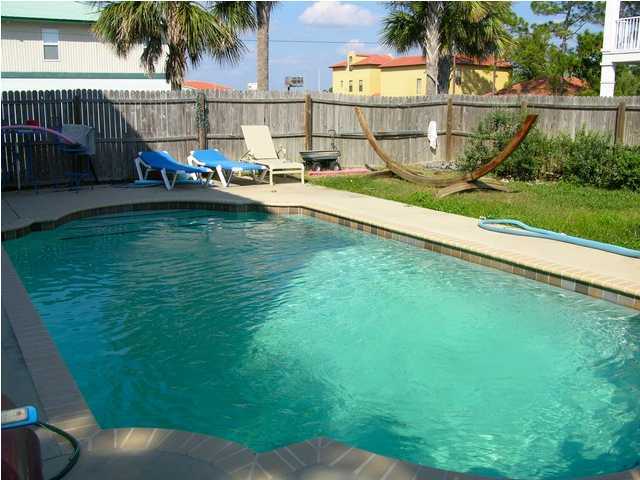 27 Hatchew Road Destin, FL 32550 - Photo 11 of 31 a view of swimming pool with outdoor seating and plants