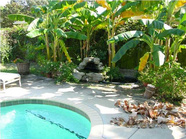 27 Hatchew Road Destin, FL 32550 - Photo 12 of 31 a view of a garden with a tree