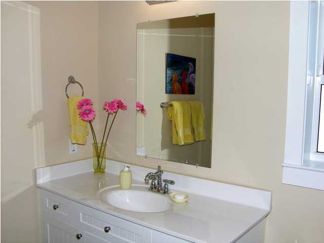 27 Hatchew Road Destin, FL 32550 - Photo 17 of 31 a bathroom with a sink vanity and a mirror