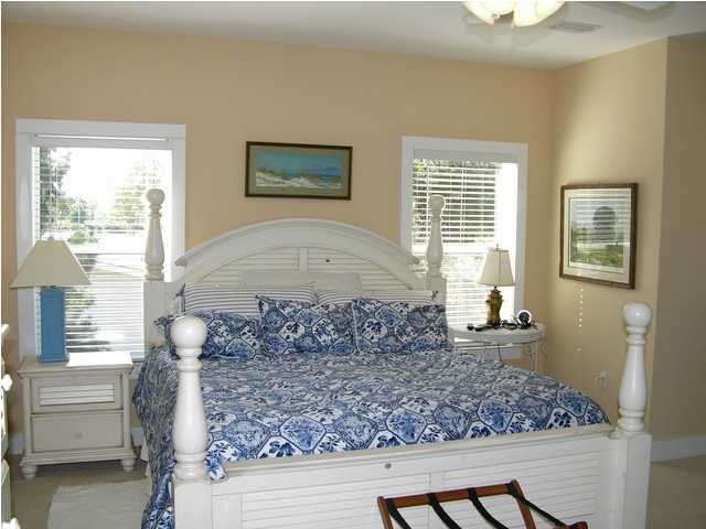 27 Hatchew Road Destin, FL 32550 - Photo 19 of 31 a room with lots of wooden furniture and a window