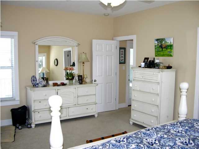 27 Hatchew Road Destin, FL 32550 - Photo 21 of 31 a bedroom with a bed and a dresser