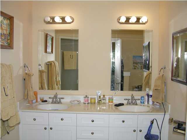 27 Hatchew Road Destin, FL 32550 - Photo 23 of 31 a bathroom with a double vanity sink and a mirror