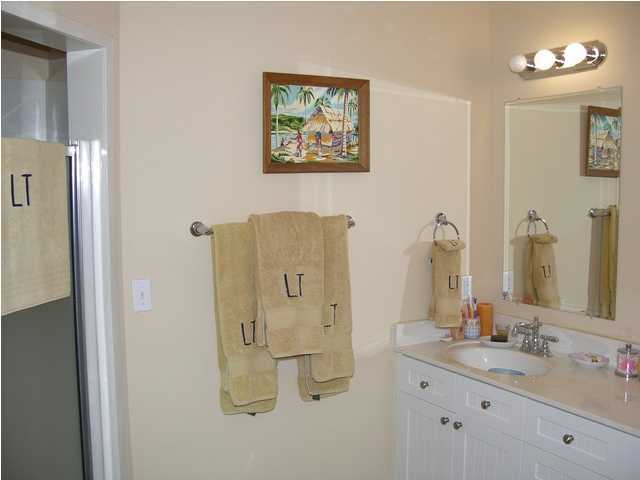 27 Hatchew Road Destin, FL 32550 - Photo 24 of 31 a bathroom with a double vanity sink mirror and toilet