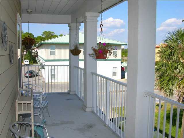 27 Hatchew Road Destin, FL 32550 - Photo 26 of 31 a view of a porch with furniture and garden