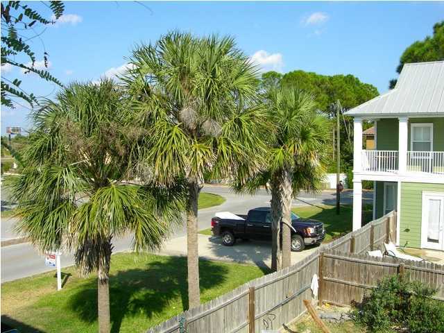 27 Hatchew Road Destin, FL 32550 - Photo 29 of 31 a view of swimming pool with lawn chairs and plants