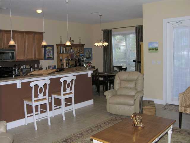 27 Hatchew Road Destin, FL 32550 - Photo 4 of 31 a kitchen with stainless steel appliances granite countertop a sink and a stove