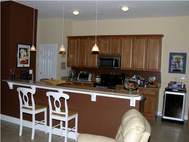 27 Hatchew Road Destin, FL 32550 - Photo 5 of 31 a kitchen with a stove a sink and a microwave
