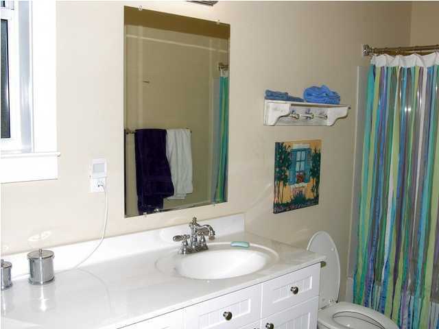 27 Hatchew Road Destin, FL 32550 - Photo 9 of 31 a bathroom with a sink toilet and shower