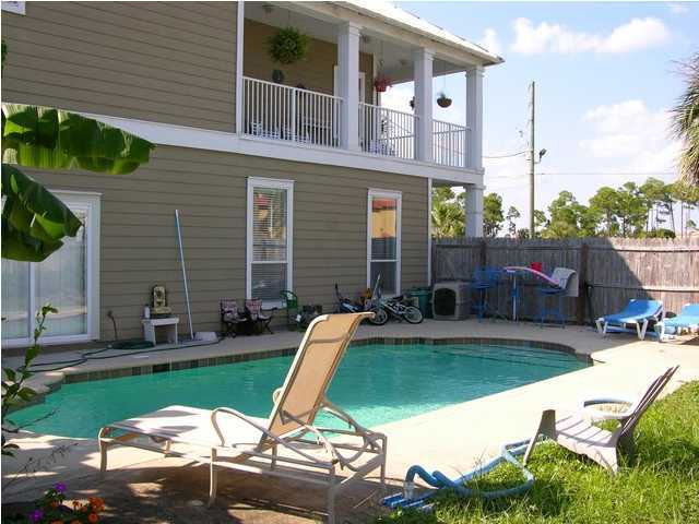 27 Hatchew Road Destin, FL 32550 - Photo 10 of 31 a view of a house with backyard sitting area and swimming pool