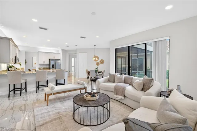 a living room with furniture and window