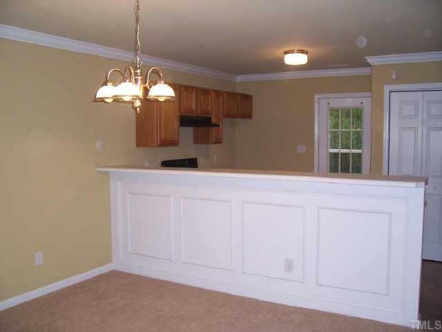2221 Violet Court Raleigh, NC 27610 - Photo 3 of 9 New wainscoating highlights the kitchen/breakfast bar area. Other