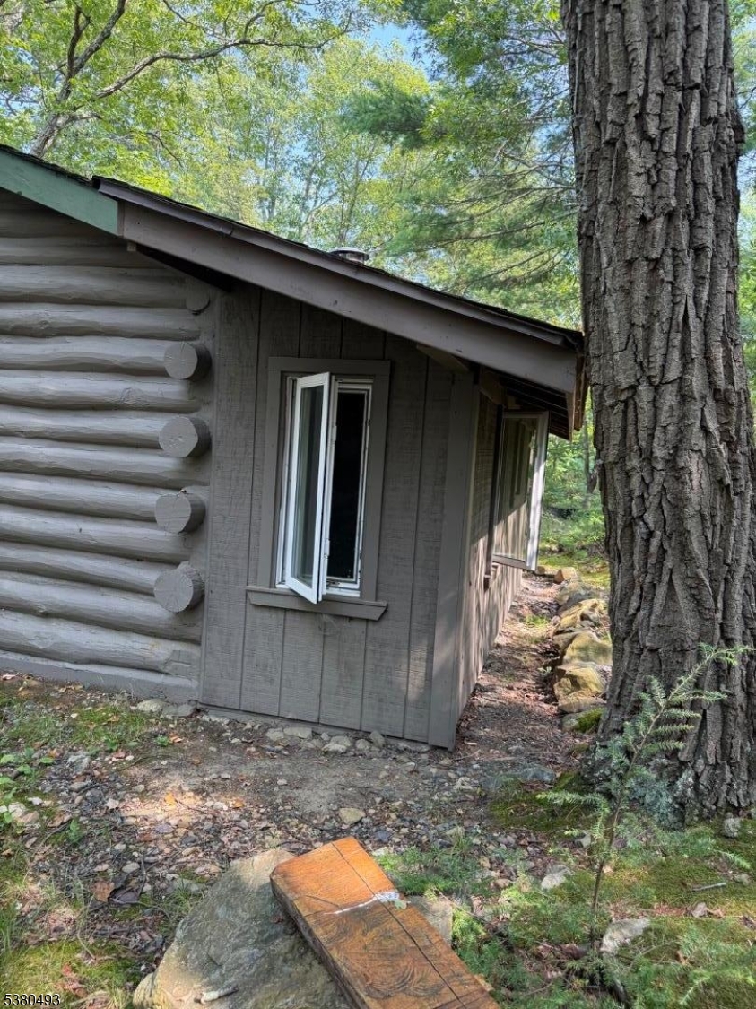 0 Rock Ledge Road West Milford, NJ 07480 - Photo 7 of 17 a backyard of a house with large trees