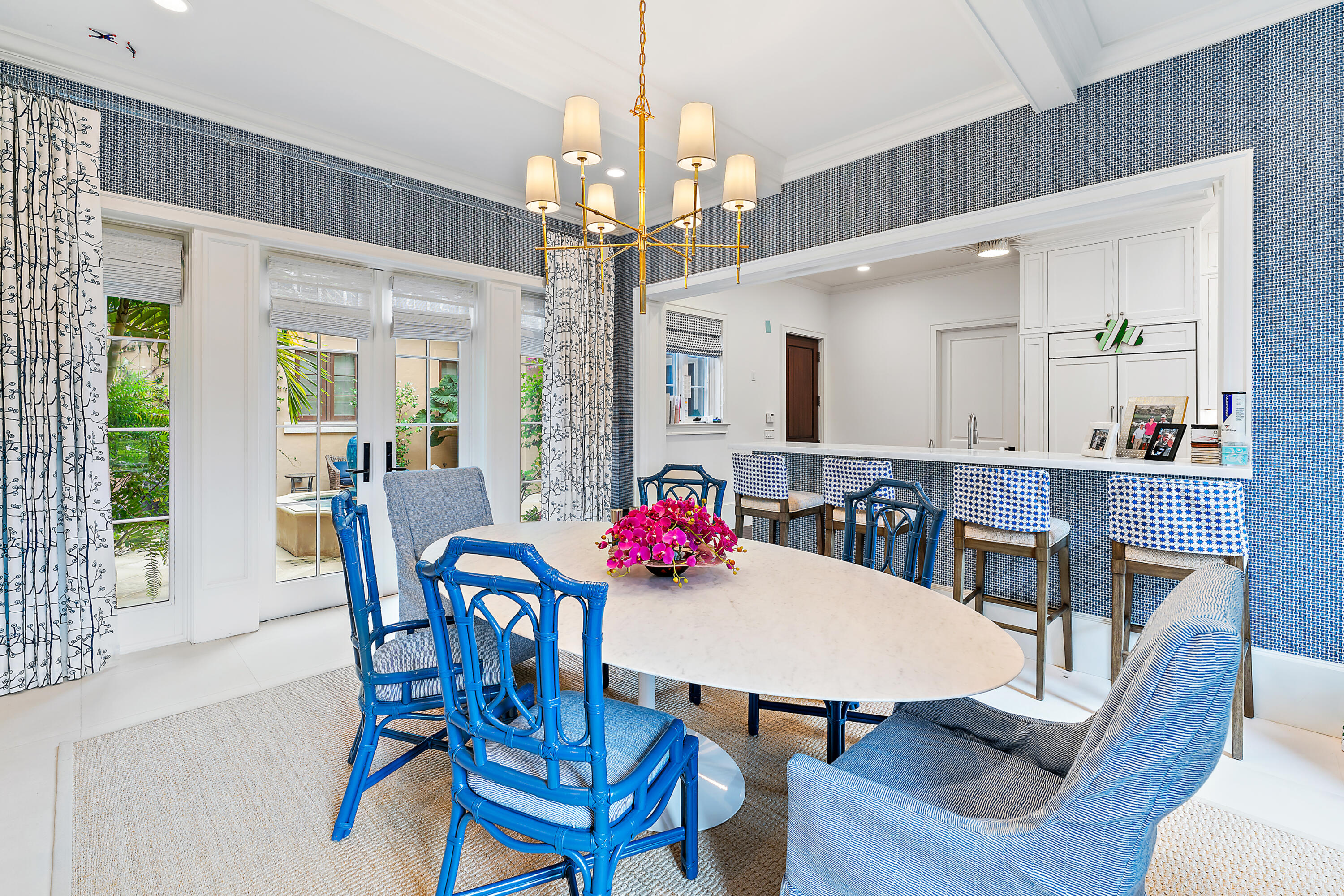 426 Via Del Orso Drive Jupiter, FL 33477 - Photo 18 of 54 a view of a dining room with furniture and a chandelier