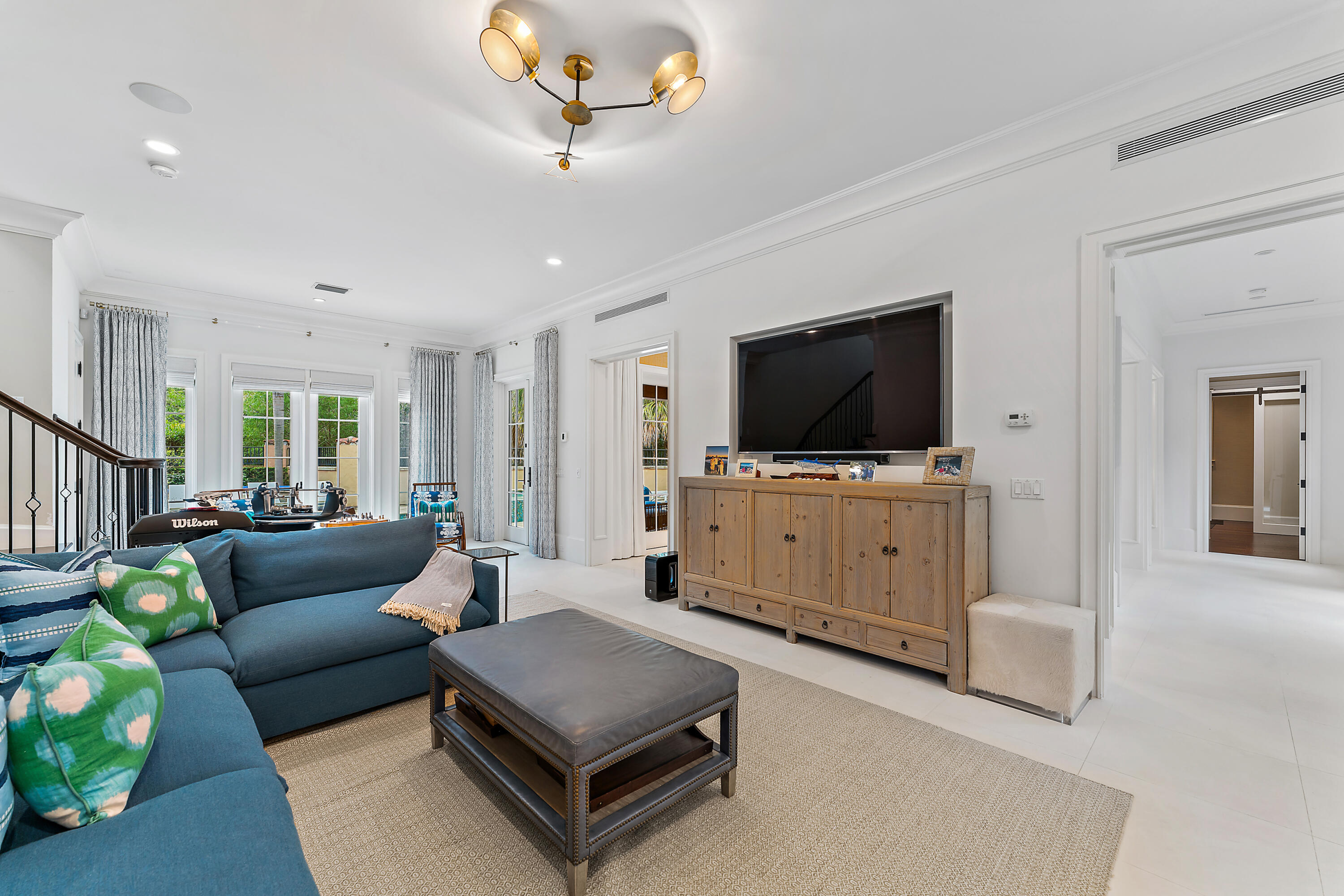 426 Via Del Orso Drive Jupiter, FL 33477 - Photo 23 of 54 a living room with furniture and a flat screen tv