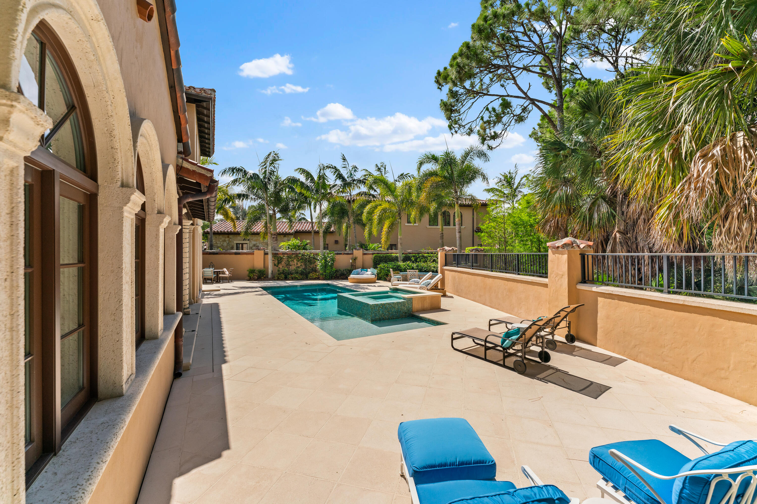426 Via Del Orso Drive Jupiter, FL 33477 - Photo 44 of 54 a view of a swimming pool with a patio and garden