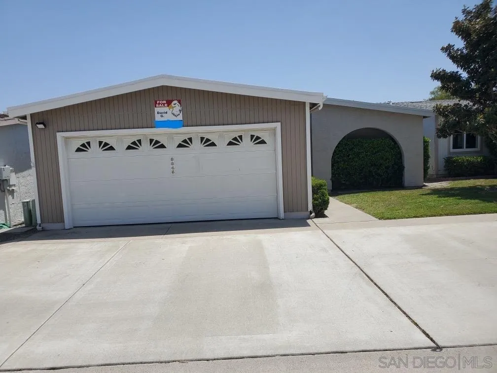 a front view of a house with trees