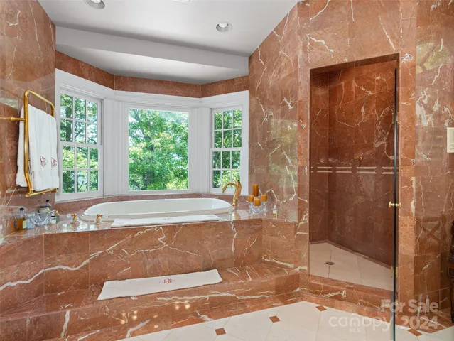 a bath tub sitting next to a window