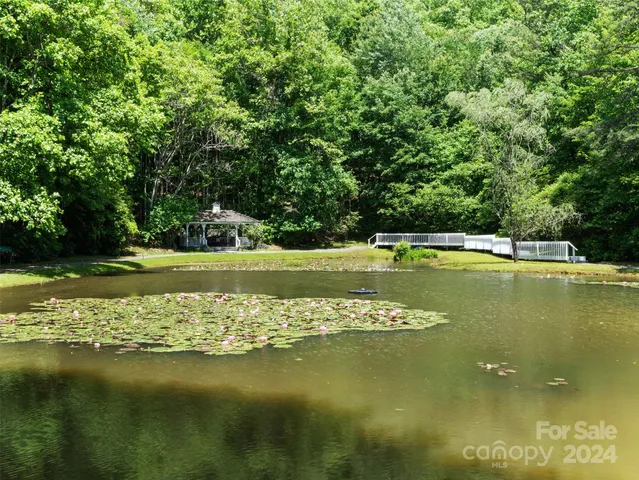 a view of a two chairs and table in the yard