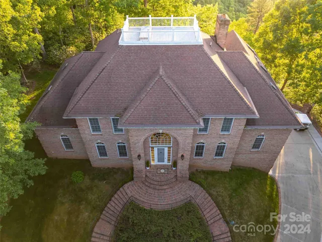 a backyard of a house with a tree