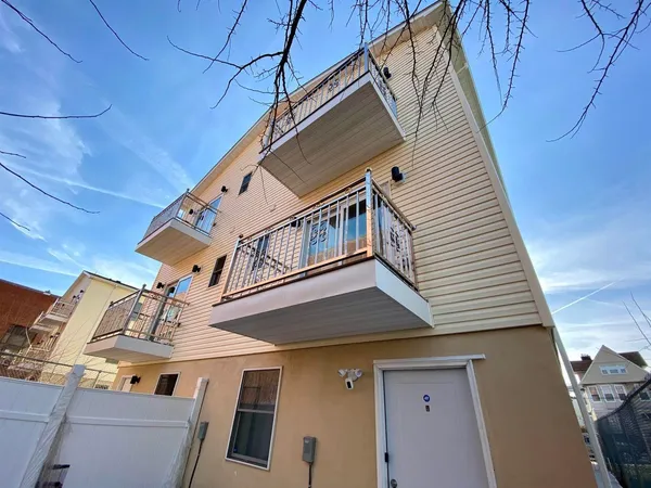 a bedroom with bed and large window