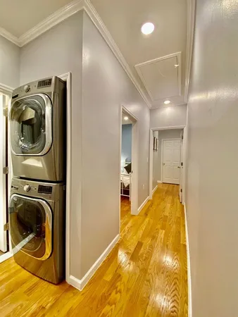 a bed room with a bed and a chandelier