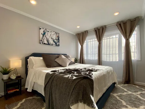 a bathroom with a sink and bathtub with shower