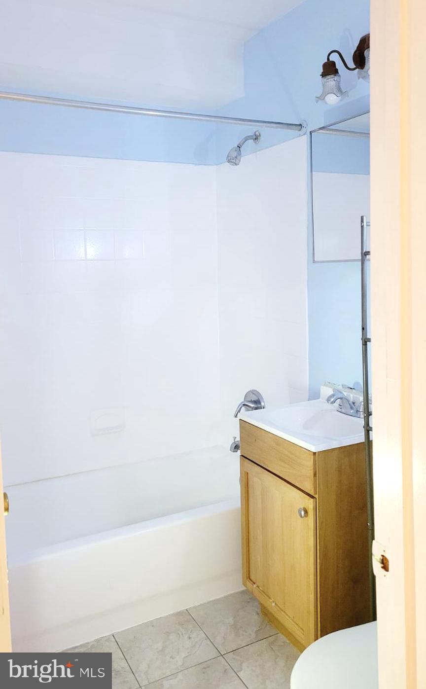 1712 Capitol Avenue Northeast Washington, DC 20002 - Photo 15 of 15 a bathroom with a sink a vanity and a shower