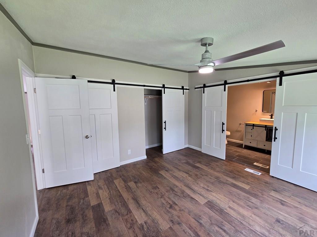 8229 Green Lane Rye, CO 81069 - Photo 14 of 24 a view of empty room with wooden floor and ceiling fan
