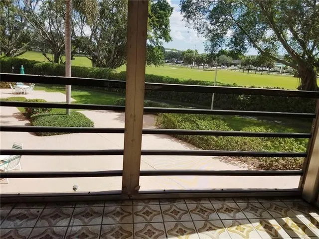 a view of swimming pool from a balcony