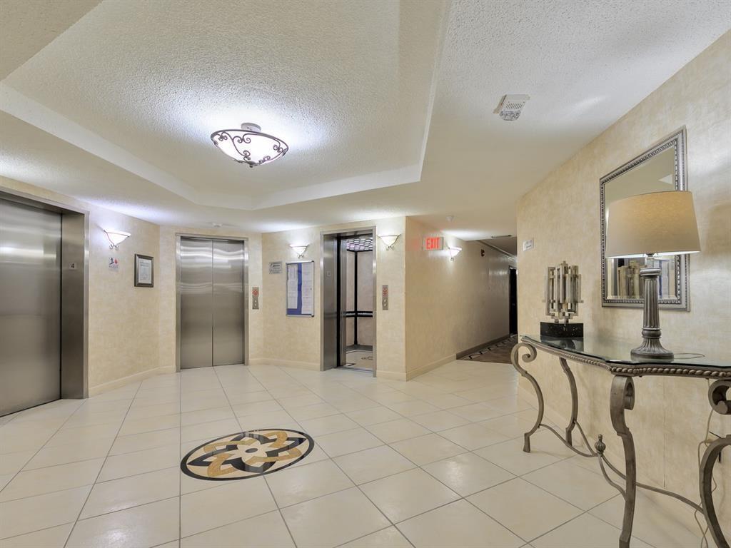 1400 St Charles Place, Unit 211 Pembroke Pines, FL 33026 - Photo 19 of 32 Elevators off main entrance of Arbor Building