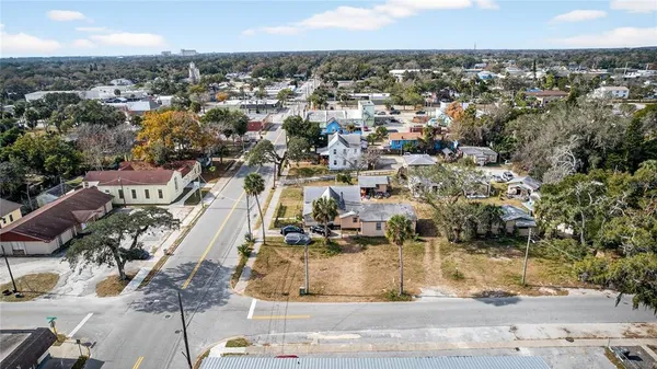 an aerial view of a house with a yard