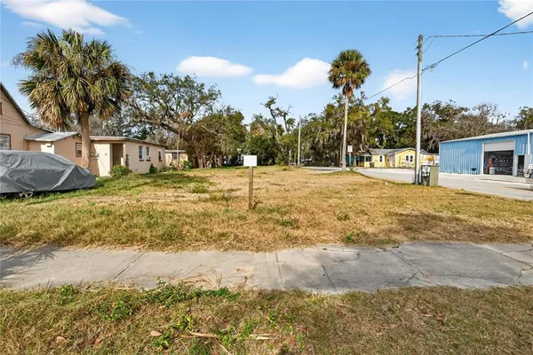 a blue swimming pool is in the middle of a yard