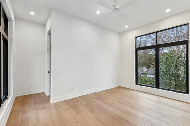 a view of a house with a wooden fence