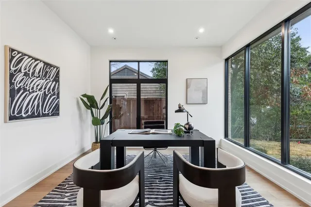 a kitchen with a table and chairs