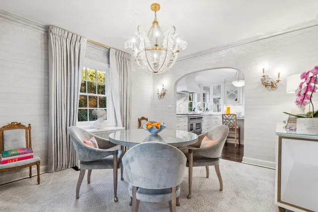 a view of a kitchen area with furniture and wooden floor