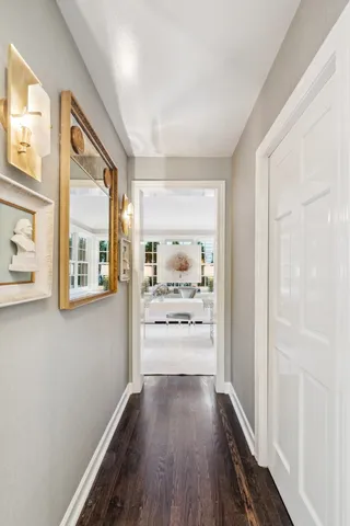 a view of a kitchen with furniture and wooden floor