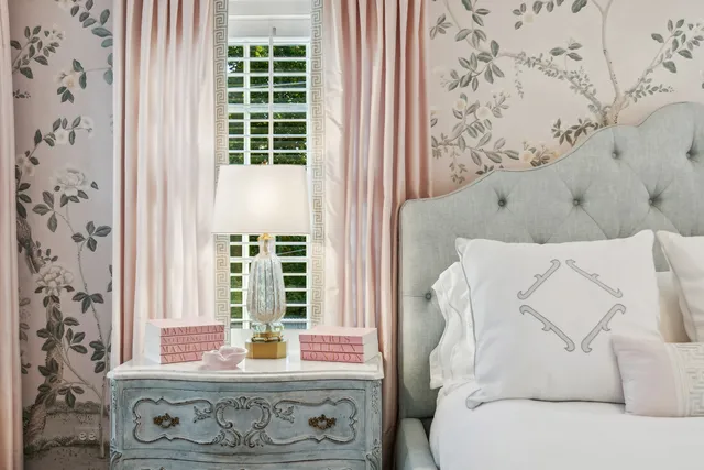 a spacious bedroom with a bed and a window