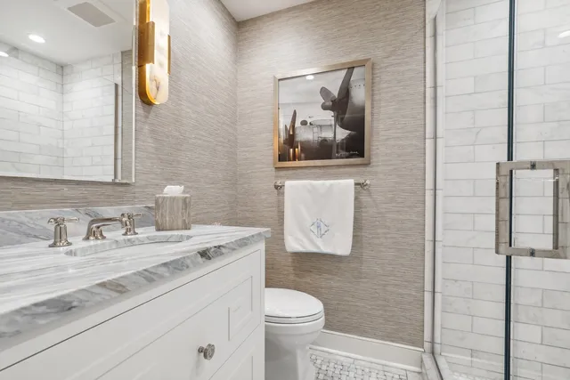 a view of a chairs and table in the back yard of the house