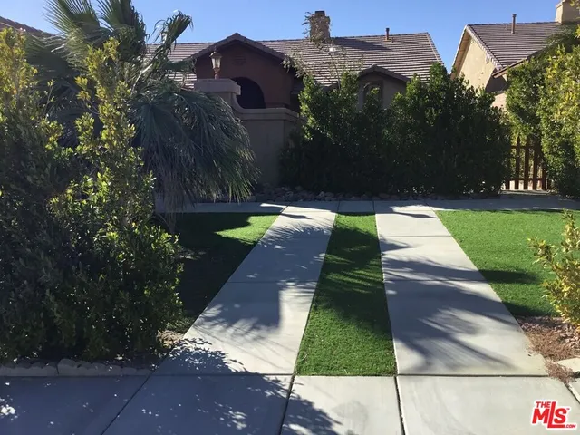 a room with a table and a fireplace