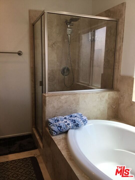 Undisclosed Address Desert Hot Springs, CA 92240 - Photo 13 of 44 a bathroom with a granite countertop shower and a sink