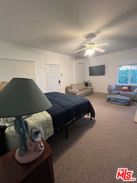 Undisclosed Address Desert Hot Springs, CA 92240 - Photo 14 of 44 a bedroom with bed and window