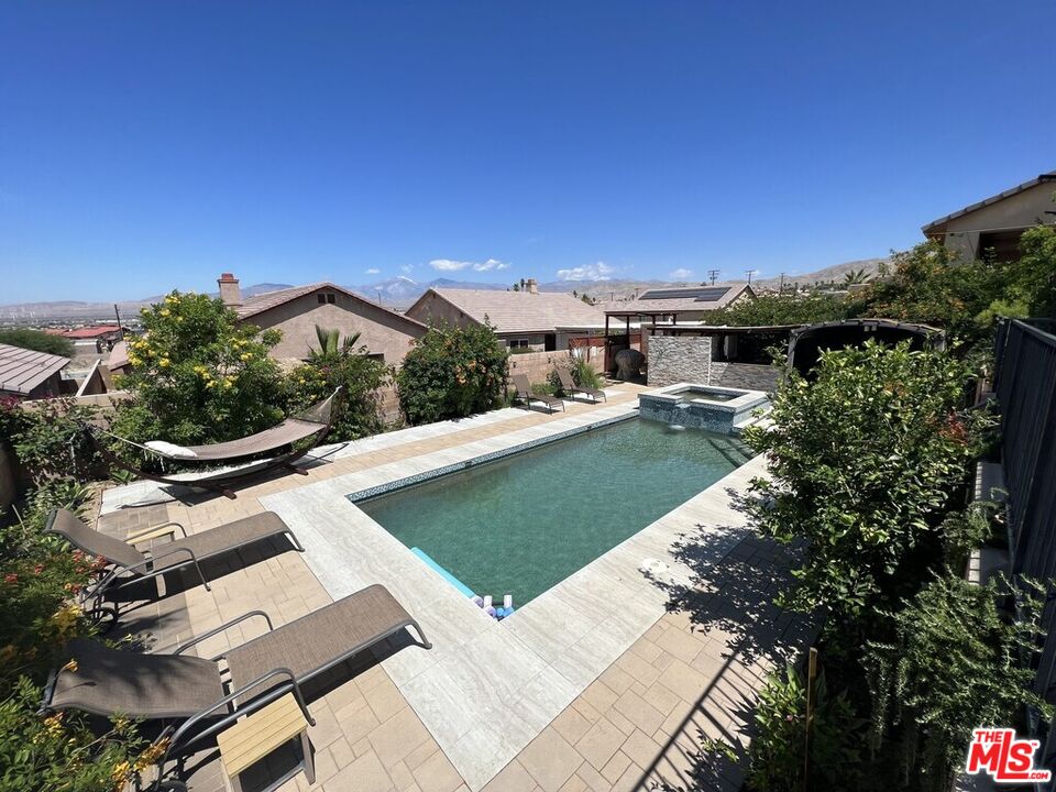 Undisclosed Address Desert Hot Springs, CA 92240 - Photo 20 of 44 a view of a swimming pool with a patio
