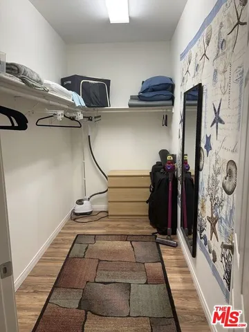a bedroom with a bed and a rug