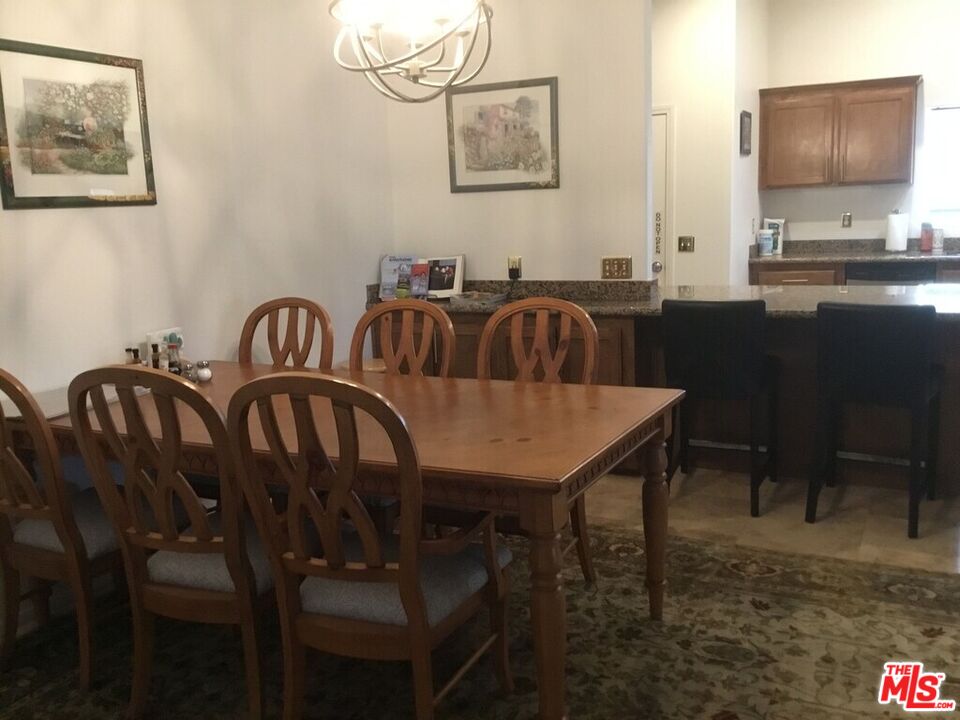 Undisclosed Address Desert Hot Springs, CA 92240 - Photo 30 of 44 a view of a dining room with furniture