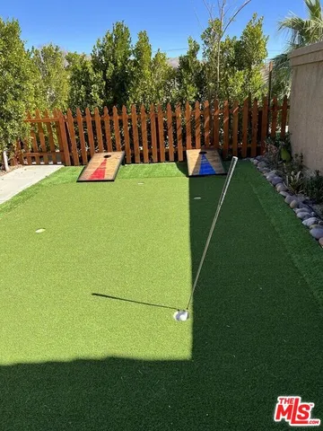 a living room with furniture and flowers