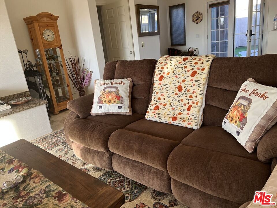 Undisclosed Address Desert Hot Springs, CA 92240 - Photo 42 of 44 a living room with furniture and a couch