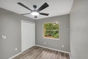 a view of an empty room with a window