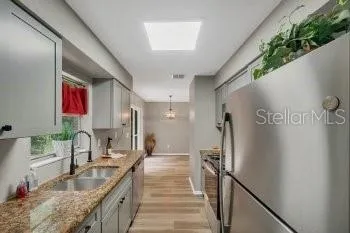 a bathroom with granite countertop a sink and a granite top